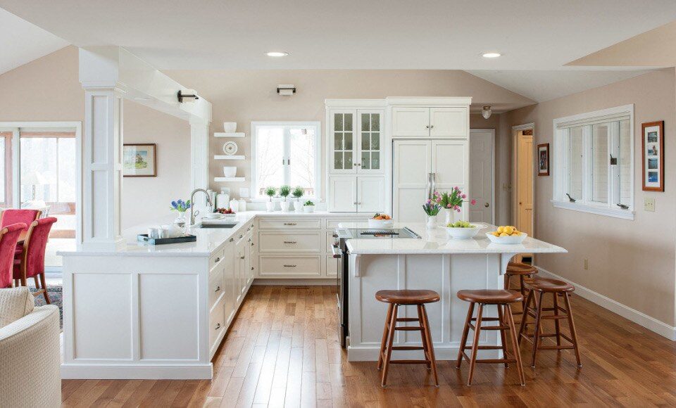 Bright white shaker kitchen with island by UKB